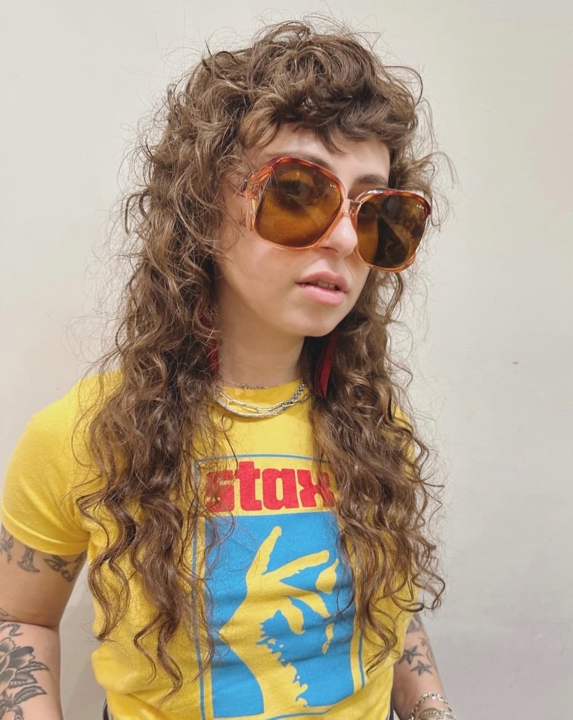 creative textured curly haircut with personality