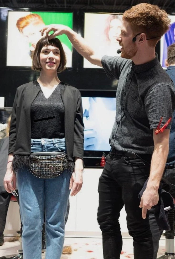 Samuel Bullen hairstylist working with client in SoHo NYC